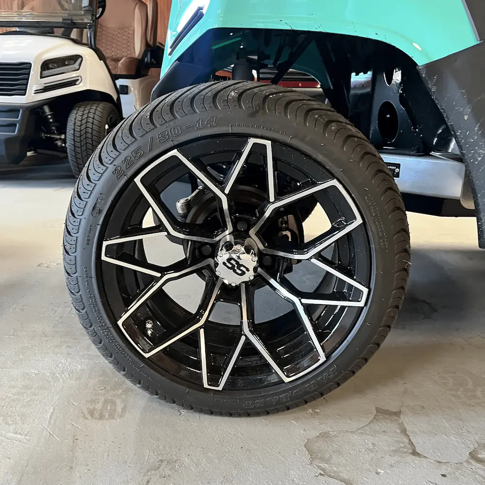 Black alloy wheel with a sleek design