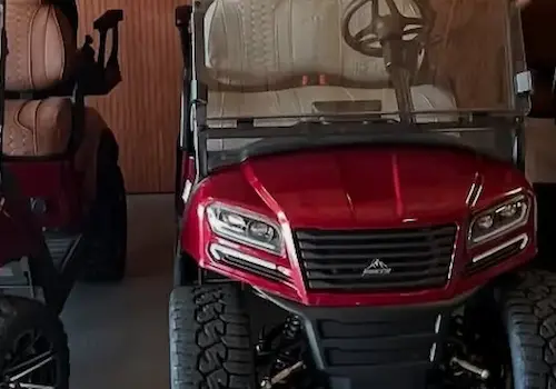 Red all-terrain vehicle in garage setting