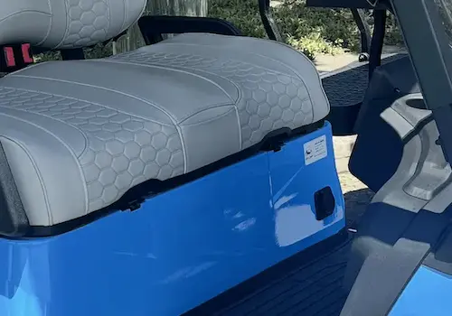 Blue vehicle seat with light gray upholstery